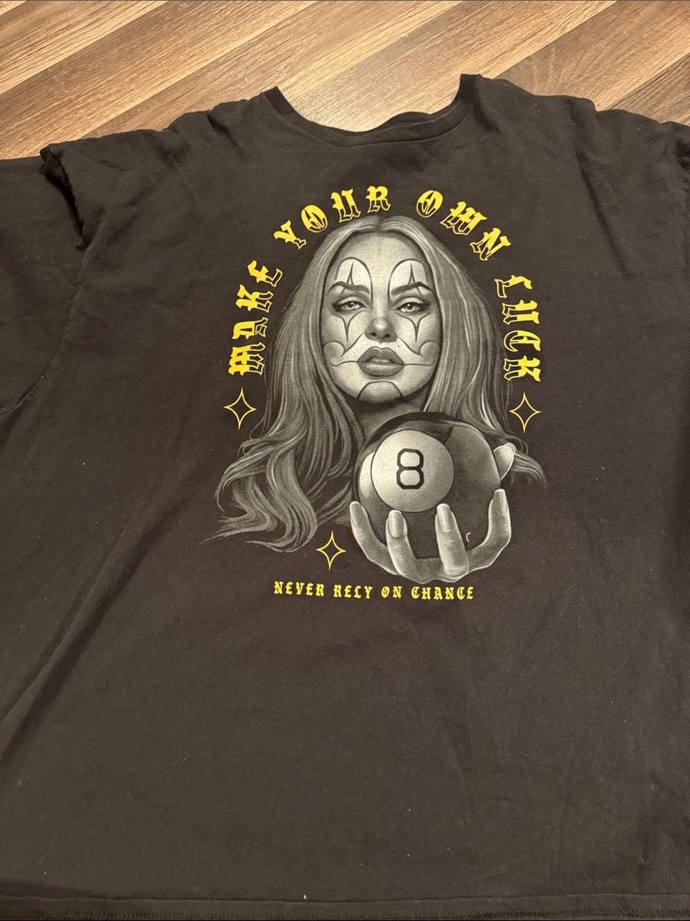 Black Graphic Tee with Fortune Teller 8-Ball Motif